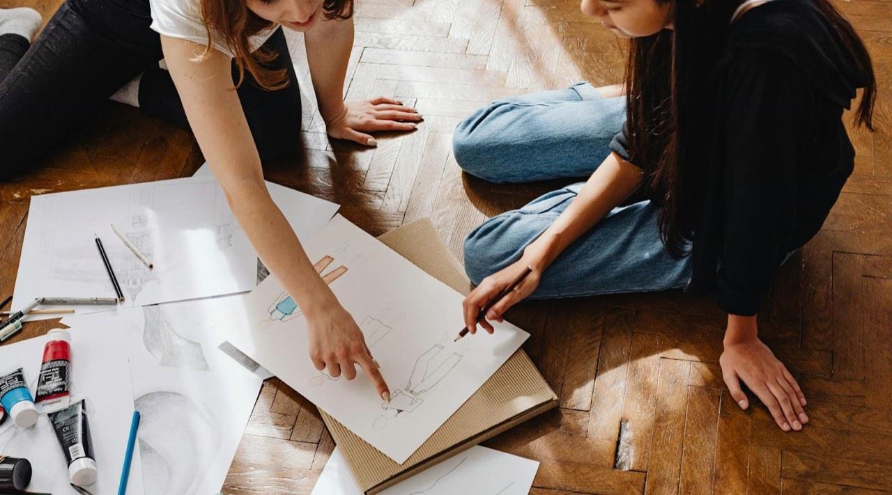 Design studio student setting suited to a Northwest College of Art and Design career launch page