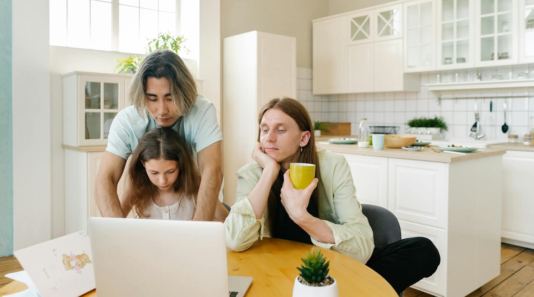 A family sits together at a dining table with a laptop open for a practical referral handoff.